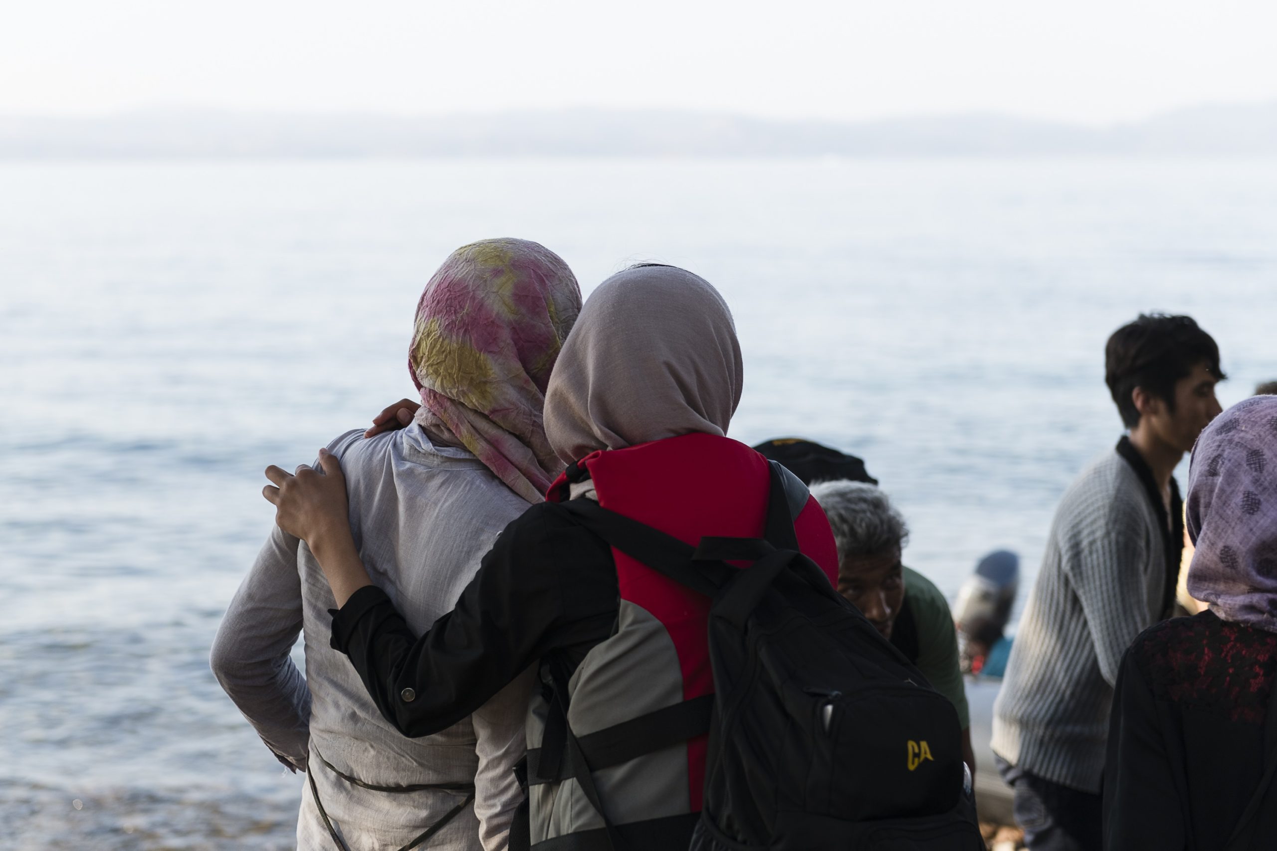 Two women hug after reaching safety in the North Shore of Lesvos.