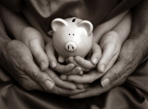 family hands piggy bank