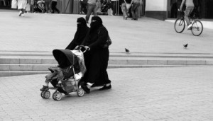 women in burquas with stroller